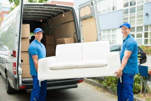 Removal team loading household furniture in Uxbridge