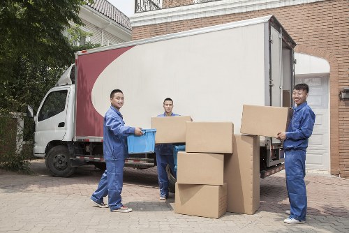 Professional piano removal team handling an upright piano in Uxbridge