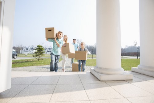 Team member following safe lifting procedures during a move