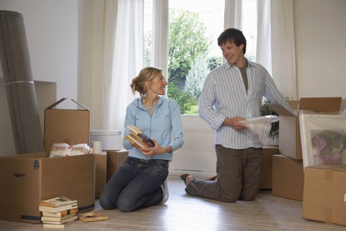 Professional movers loading household furniture for a local relocation